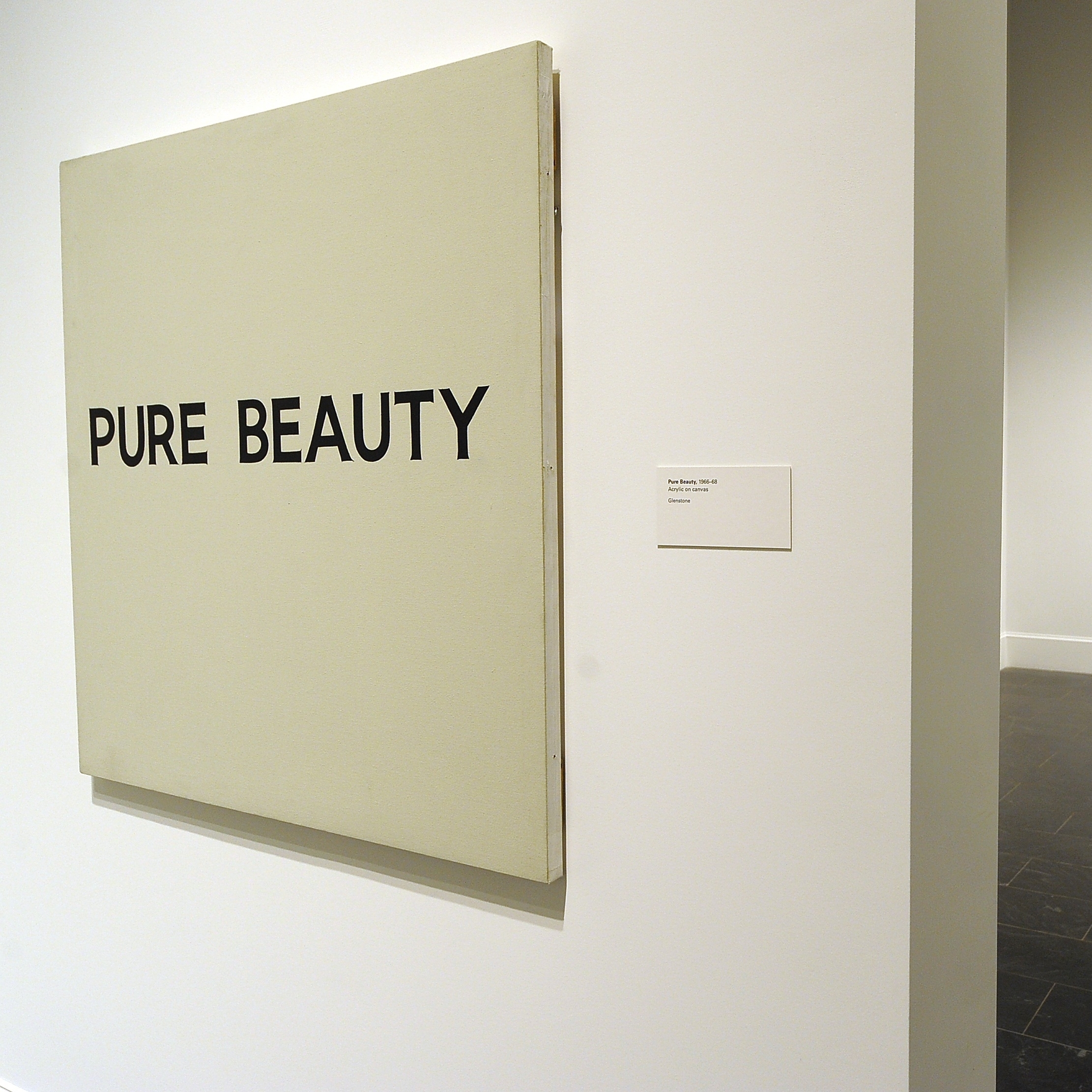 "Pure Beauty," shown here at the Metropolitan Museum of Art in New York in 2010, is one of John Baldessari's many provocative "text paintings."