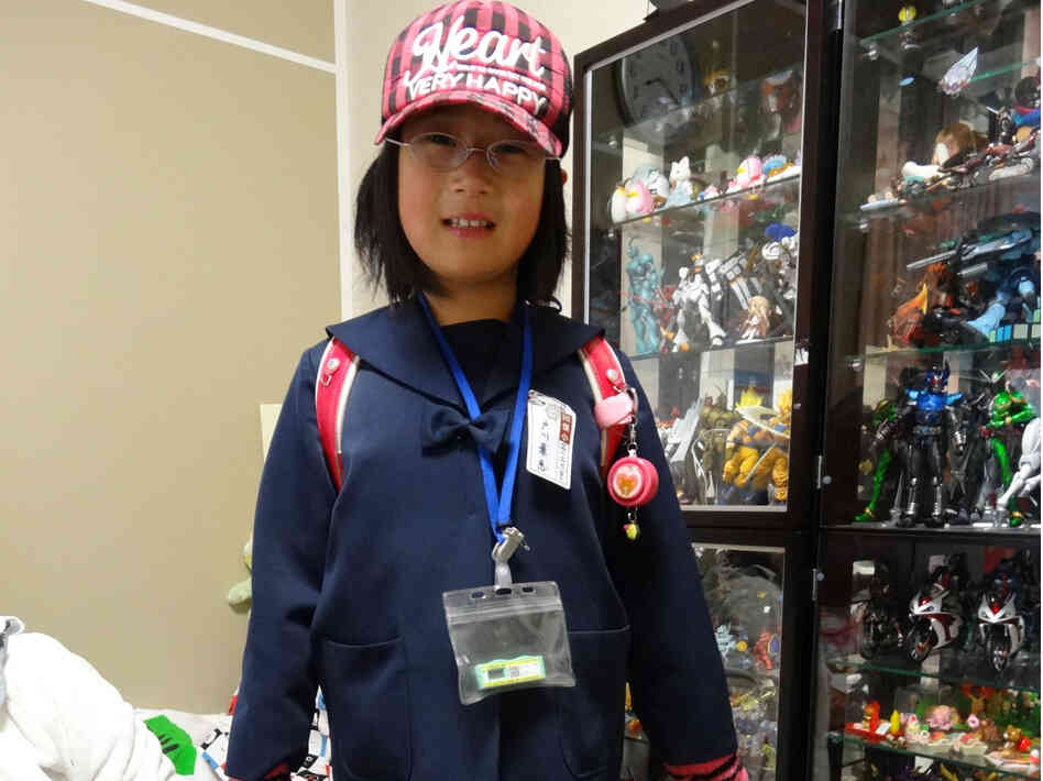 Kae Togawa, 9, must wear a radiation badge whenever she leaves the house.