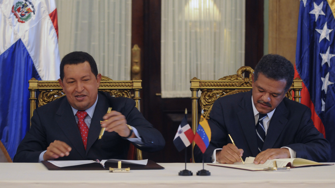 Venezuelan President Hugo Chavez and Leonel Fernandez, the president of the Dominican Republic, sign an agreement in 2010. The Dominican Republic gets about 40,000 barrels of oil a day from Venezuela.