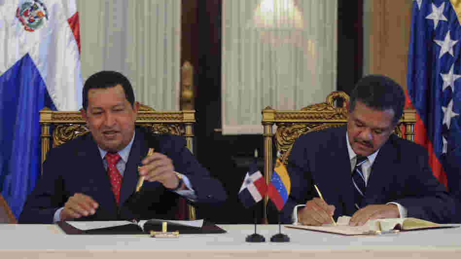 Venezuelan President Hugo Chavez and Leonel Fernandez, the president of the Dominican Republic, sign an agreement in 2010. The Dominican Republic gets about 40,000 barrels of oil a day from Venezuela.