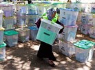 An Independent Electoral and Boundaries Commission official carries closed ballot boxes to be counted in Mombasa. An Independent Electoral and Boundaries Commission official carries closed ballot boxes to be counted in Mombasa.
