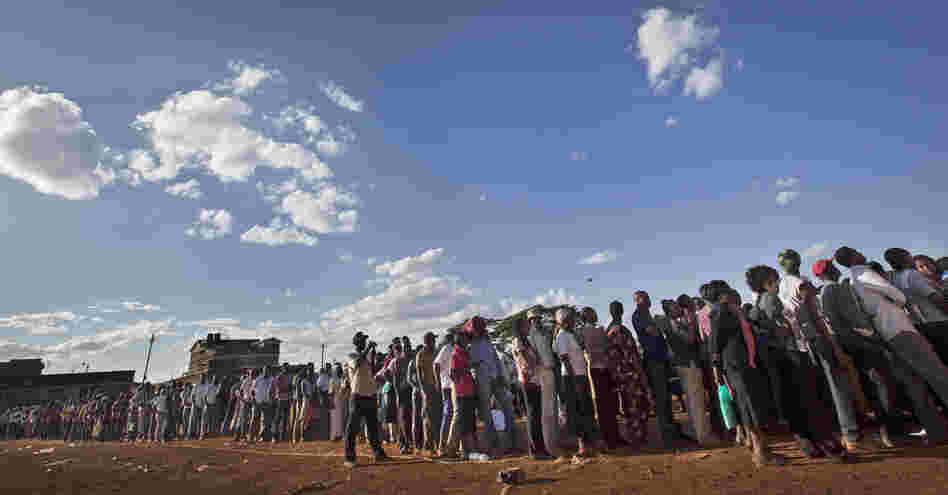 Voters queued for hours across Kenya as old-fashioned paper ballots had to be rushed to polling stations.