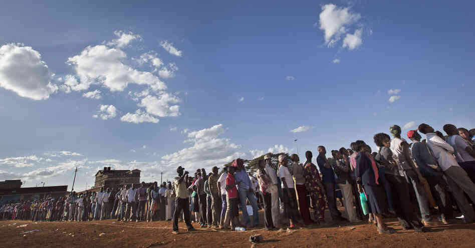 Voters queued for hours across Kenya as old-fashioned paper ballots had to be rushed to polling stations.