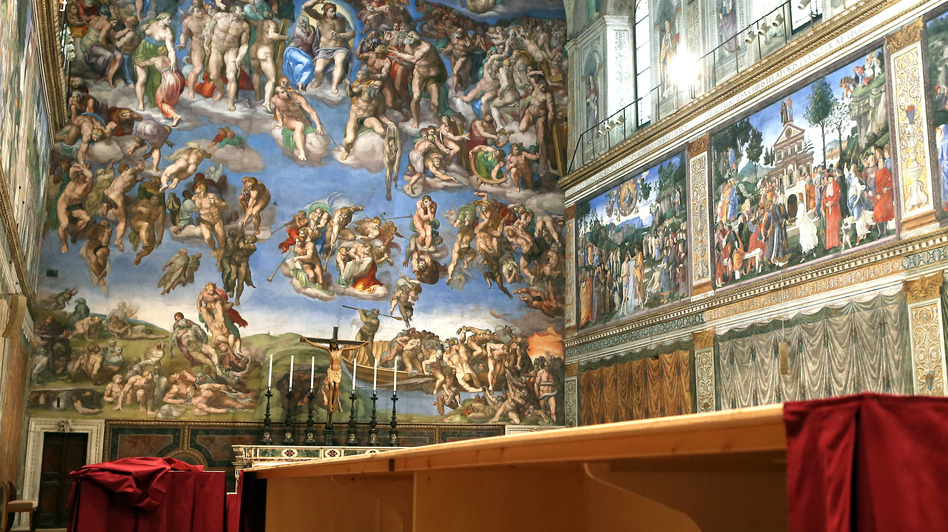 Furniture is prepared inside the Sistine Chapel before Tuesday's papal conclave in Vatican City, Vatican on Saturday.