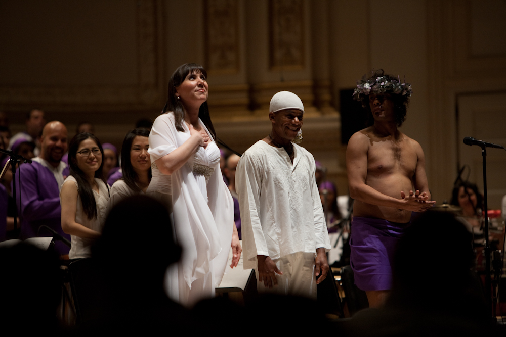 Soprano Jessica Rivera, left, Deraldo Ferreira, center, and Renaldo Gonzalez-Fernandez received enthusiastic applause after performing in Osvaldo Golijov's Passion according to St. Mark, with Orquesta La Pasion and conductor Robert Spano at Carnegie Hall, March 10, 2013.