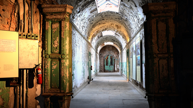 A hallway at Eastern State Penitentiary in Philadelphia. The prison, opened in 1829 and closed in 1970, pioneered the use of solitary confinement.