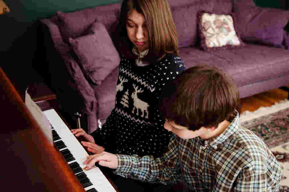 Samantha watches her brother Nicholas play piano. Their mother says that a new customized voice created by researcher Rupal Patel from a young Samantha's voice sample is happy and has a sweetly familiar quality. "My son — my son Nicholas — I could hear some of his voice in it," she says.
