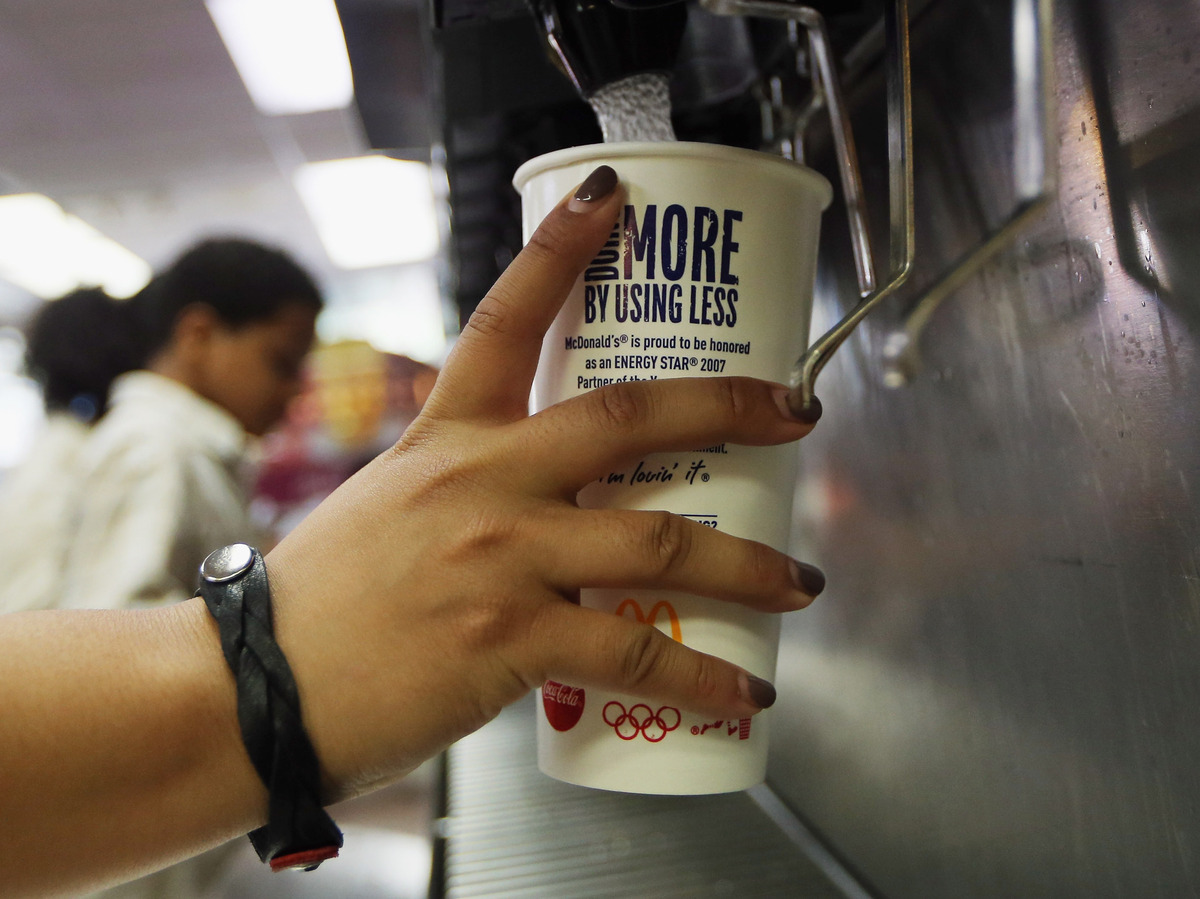 A customer fills a 21-ounce cup with soda at a New York City McDonald's.