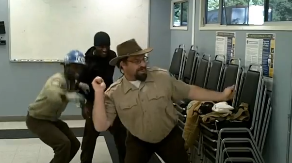 A boss learning some moves from his employees.