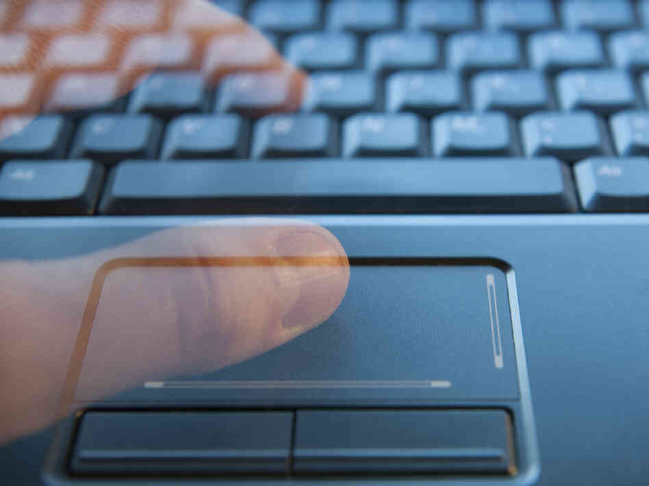 Ghostly fingers on a computer keyboard.