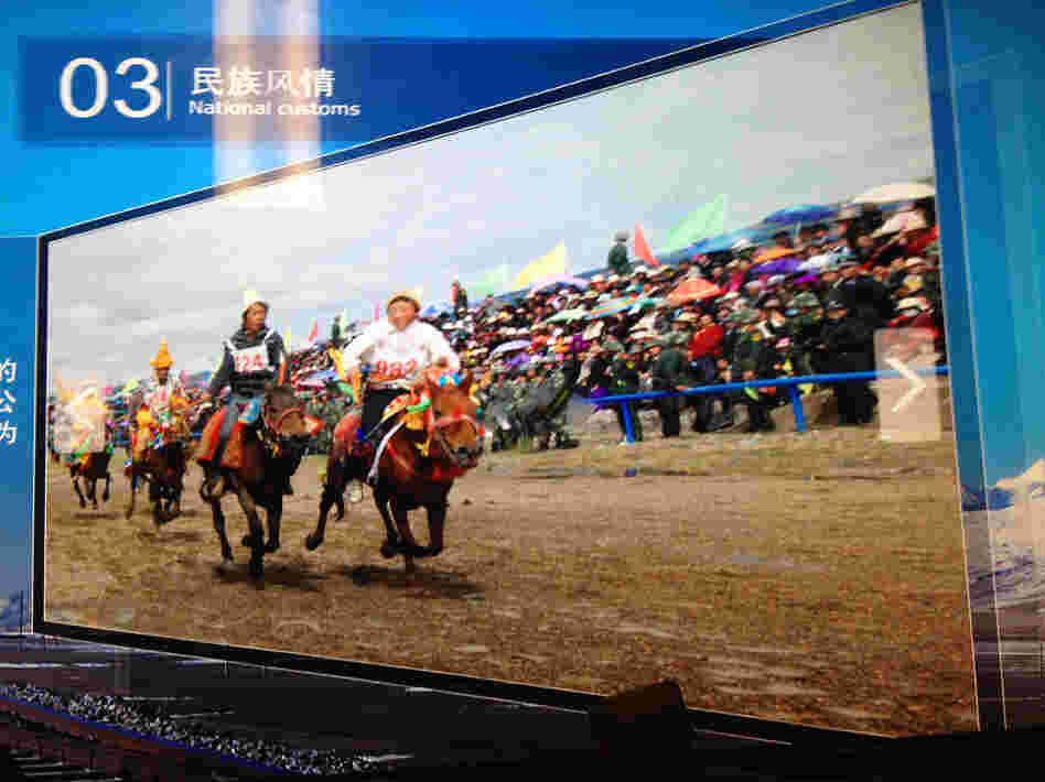 A close look at a photo of the Nagqu horse festival in northern Tibet at the National Museum of China in Beijing reveals a gaggle of surprising "spectators" at the traditional Tibetan event: Chinese paramilitary police (see enlargement).