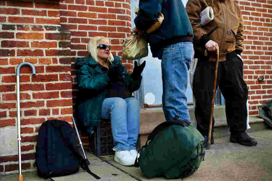 While in line at the United Church of Christ soup kitchen, Tony passes Andrea a bag full of her prescription medications. Before being homeless, Andrea suffered from a host of ailments that have only gotten worse, and now she needs both knees replaced. "I'm living on painkillers," she says.