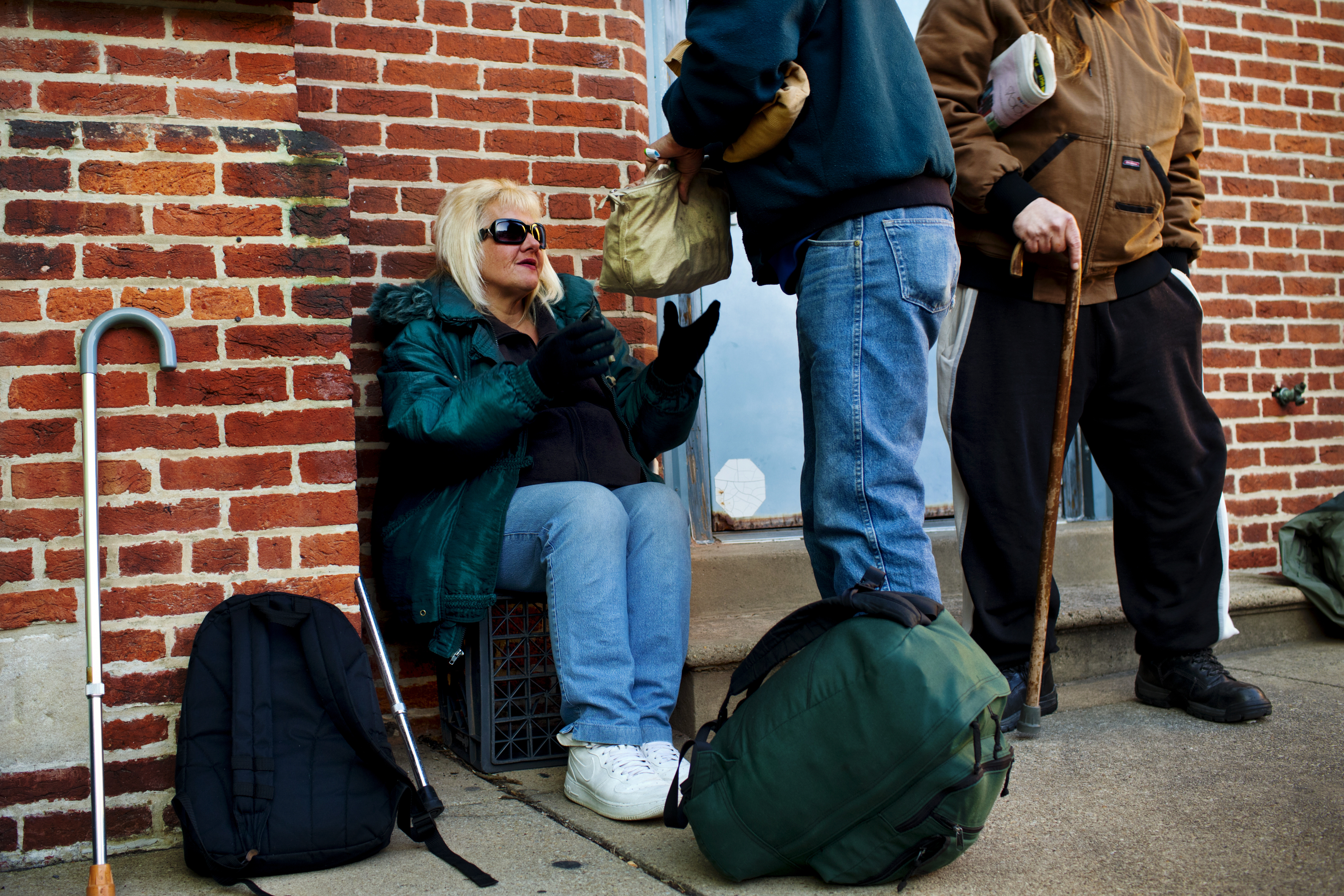 While in line at the United Church of Christ soup kitchen, Tony passes Andrea a bag full of her prescription medications. Before being homeless, Andrea suffered from a host of ailments that have only gotten worse, and now she needs both knees replaced. "I'm living on painkillers," she says.