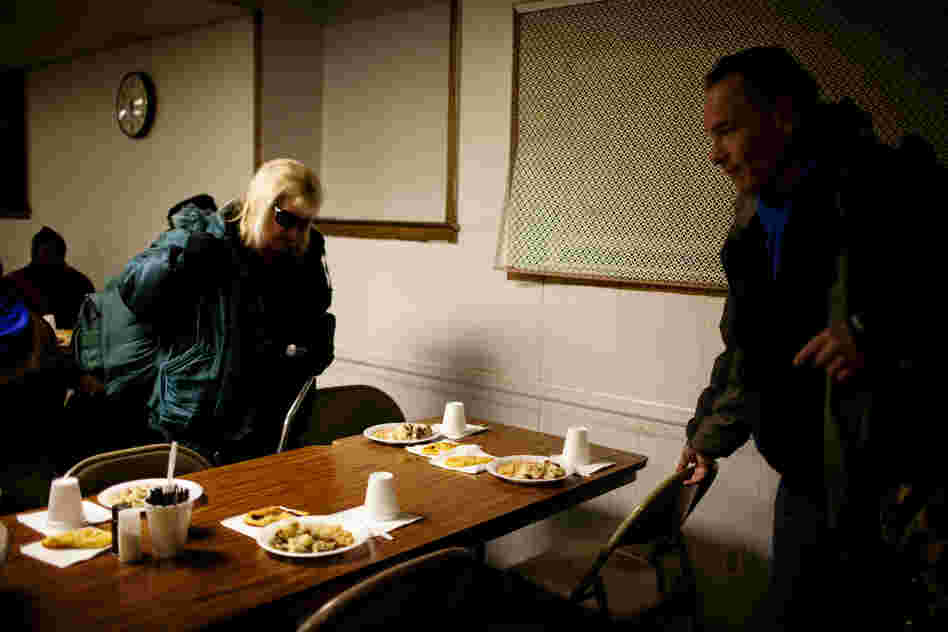 Andrea and Tony sit down to eat a meal consisting of white beans, mashed potatoes, hot dogs and a roll. It's challenging to eat healthy when you are on the streets, often relying on free meals.