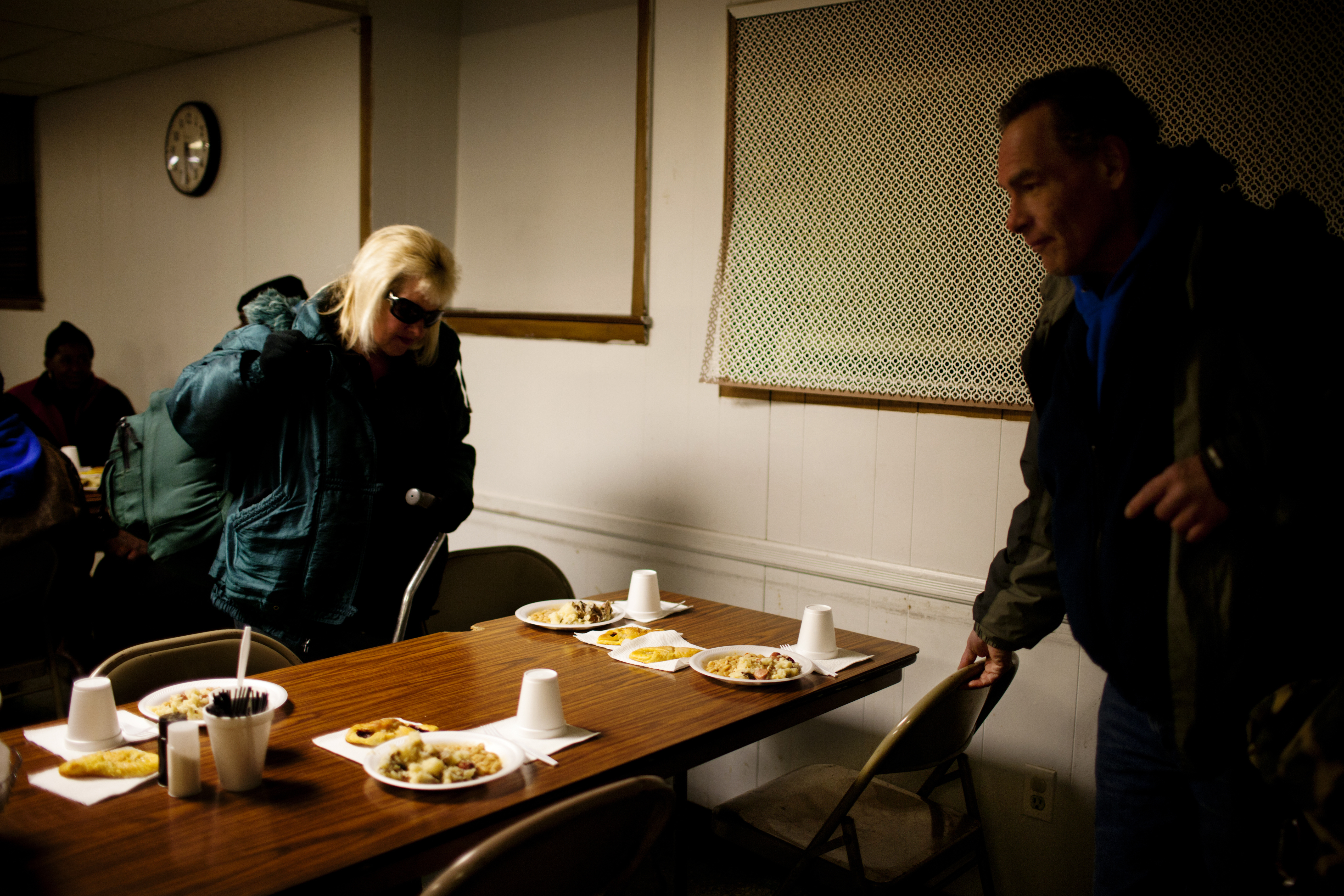 Andrea and Tony sit down to eat a meal consisting of white beans, mashed potatoes, hot dogs and a roll. It's challenging to eat healthy when you are on the streets, often relying on free meals.