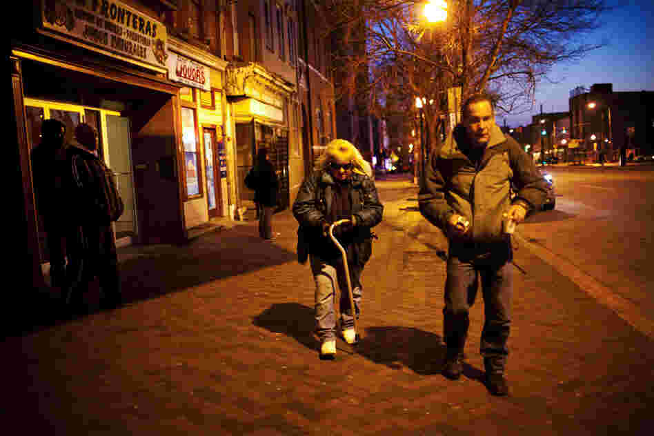 After dinner, they walk to a bus stop to catch a free bus to a parking lot where they sleep.