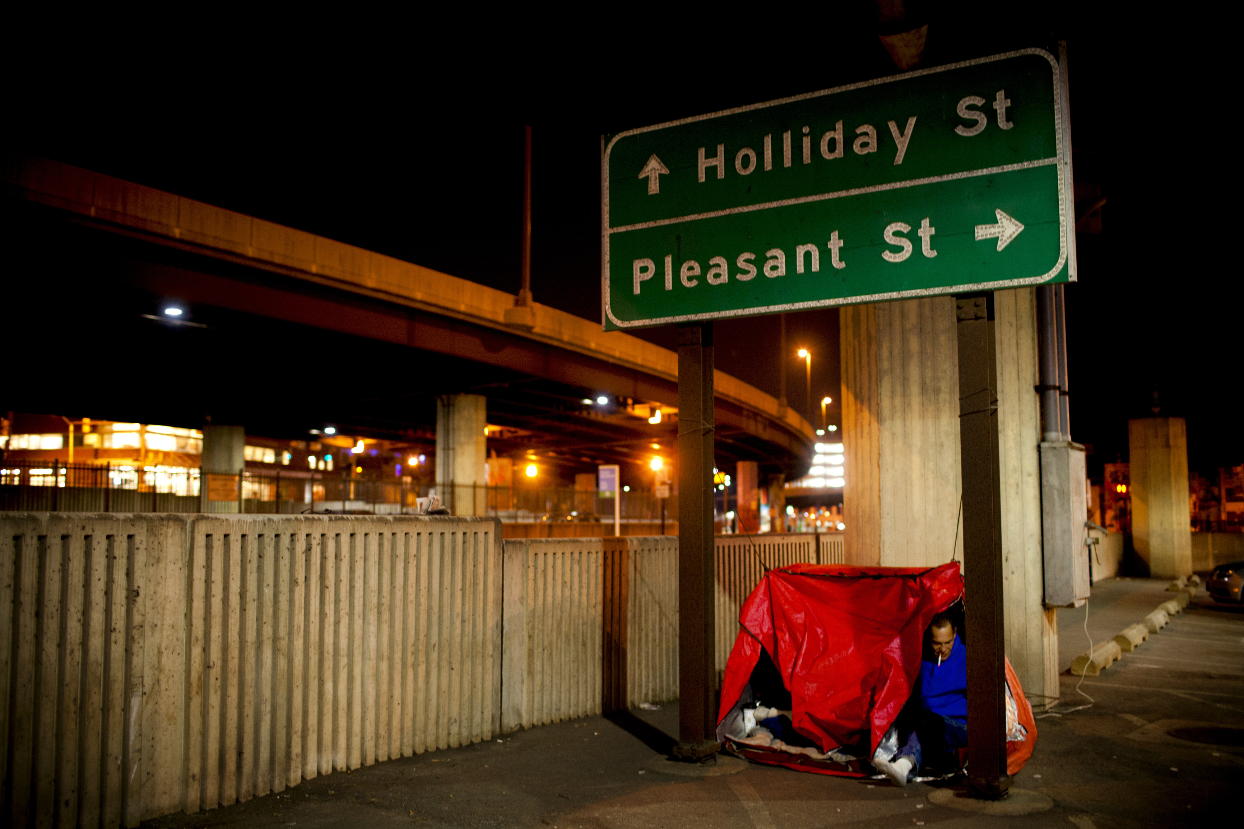 Tony plugs a small heater into an outlet in the parking lot. "We're sort of living high class compared to what these people are living," says Andrea, referring to the dozens of others sleeping nearby. "We're warm at night. These people are freezing to death."