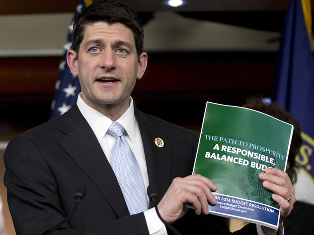 House Budget Committee Chairman Rep. Paul Ryan, R-Wis., holds up a copy of the 2014 Budget Resolution as he speaks during a news conference on Capitol Hill in Washington, Tuesday, March 12, 2013.
