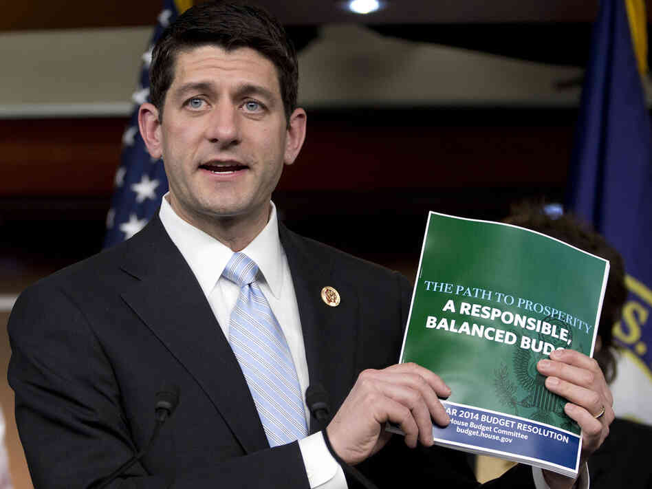 House Budget Committee Chairman Rep. Paul Ryan, R-Wis., holds up a copy of the 2014 Budget Resolution as he speaks during a news conference on Capitol Hill in Washington, Tuesday, March 12, 2013.