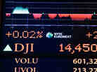 A board on the floor of the New York Stock Exchange shows the closing number for the Dow Jones industrial average, Tuesday, March 12, 2013.