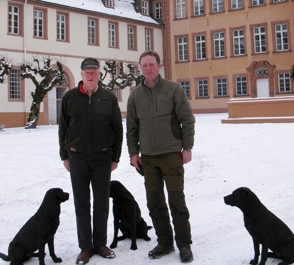 Prince Richard (left) and his son, Prince Gustav, stand in front of their palace in Bad Berleburg. The elder prince decided to reintroduce wisents into the wild in Germany a decade ago, but opponents and red tape hampered his efforts until recently.