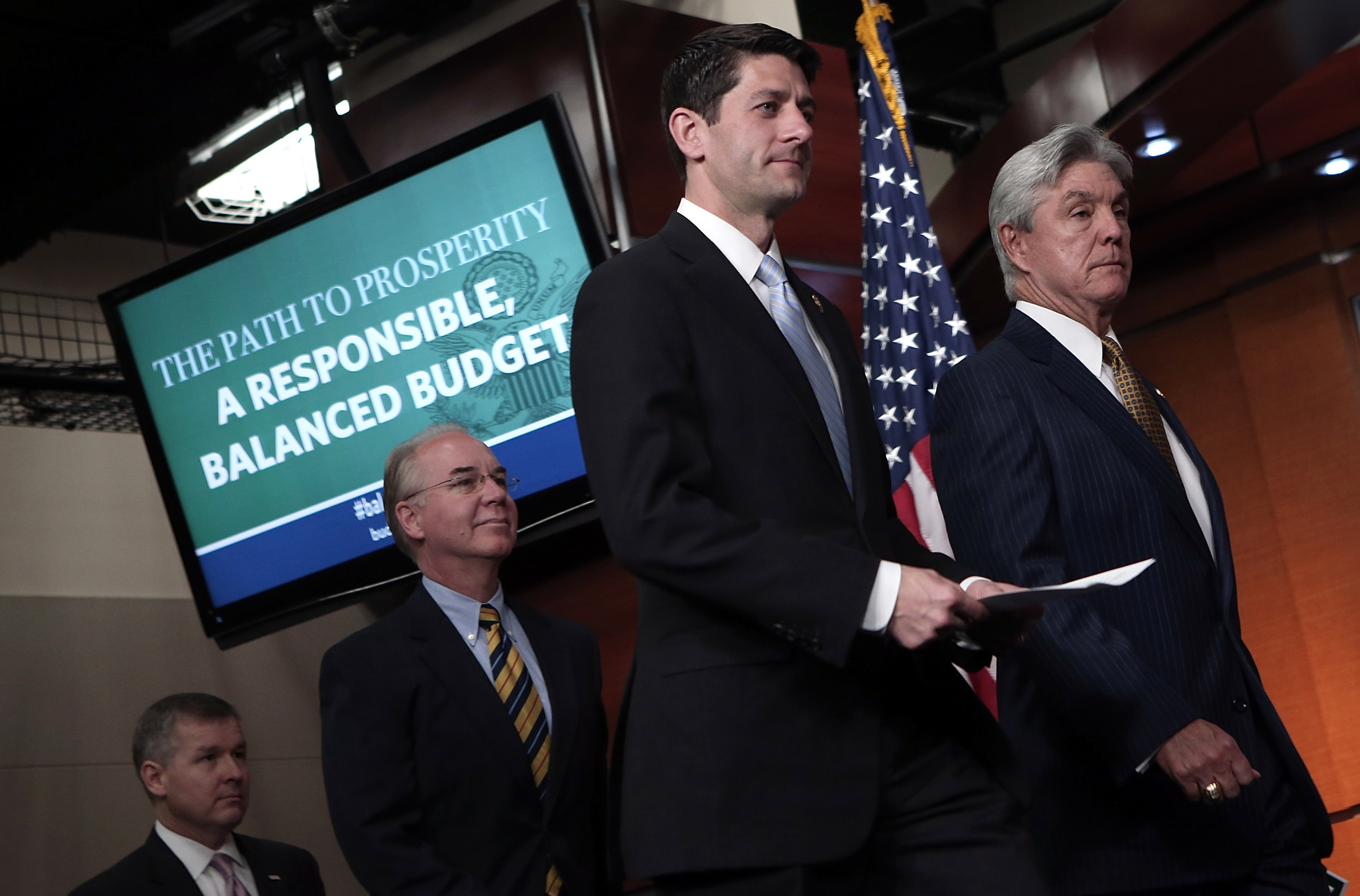 Rep. Paul Ryan (R-WI) (second from right), arrives with other GOP members of the House Budget Committee he chairs, for a news conference, March 12, 2013.