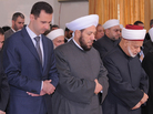 Syria's Grand Mufti Ahmad Hassoun (right) prays with President Bashar Assad in Damascus on Feb. 5, 2012. The grand mufti has called on Syrians to join the army and fight for the government, his most partisan statement since the country's uprising began two years ago. Syria's Grand Mufti Ahmad Hassoun (right) prays with President Bashar Assad in Damascus on Feb. 5, 2012. The grand mufti has called on Syrians to join the army and fight for the government, his most partisan statement since the country's uprising began two years ago.