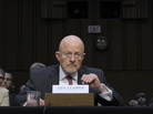 Director of National Intelligence James Clapper (center), accompanied by FBI Director Robert Mueller (left) and CIA Director John Brennan, testifies on Capitol Hill on Tuesday. Director of National Intelligence James Clapper (center), accompanied by FBI Director Robert Mueller (left) and CIA Director John Brennan, testifies on Capitol Hill on Tuesday.