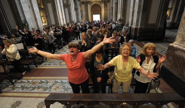 Faithful react after the announcement that Buenos Aires archbishop Jorge Mario Bergoglio was elected Pope Francis I, at Metropolitan Cathedral in Buenos Aires on Wednesday.