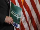 A member of the House Budget Committee holds a copy of the Republican budget proposal on Tuesday in Washington. A member of the House Budget Committee holds a copy of the Republican budget proposal on Tuesday in Washington.