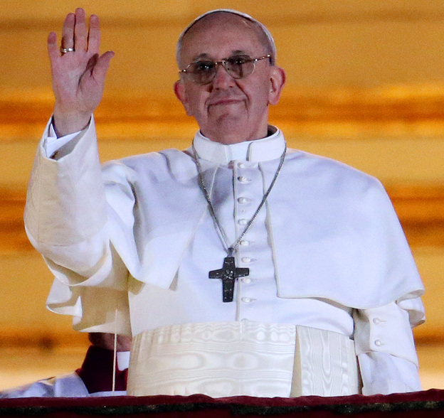 Pope Francis waves to the crowd in St. Peter's Square at the Vatican on Wednesday.