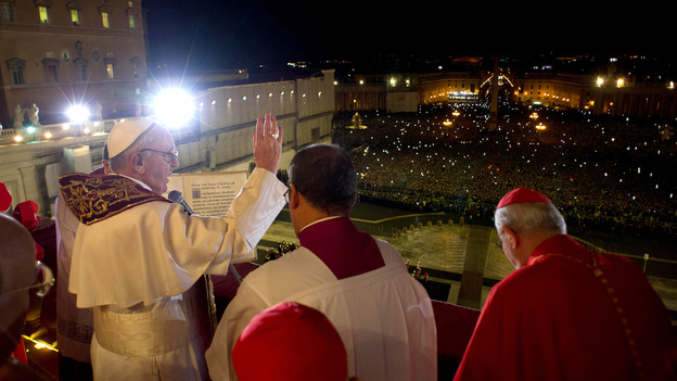 The newly elected Pope Francis  appears on the main balcony of St Peter's Basilica. His name was chosen after St. Francis of Assisi, the Vatican says.