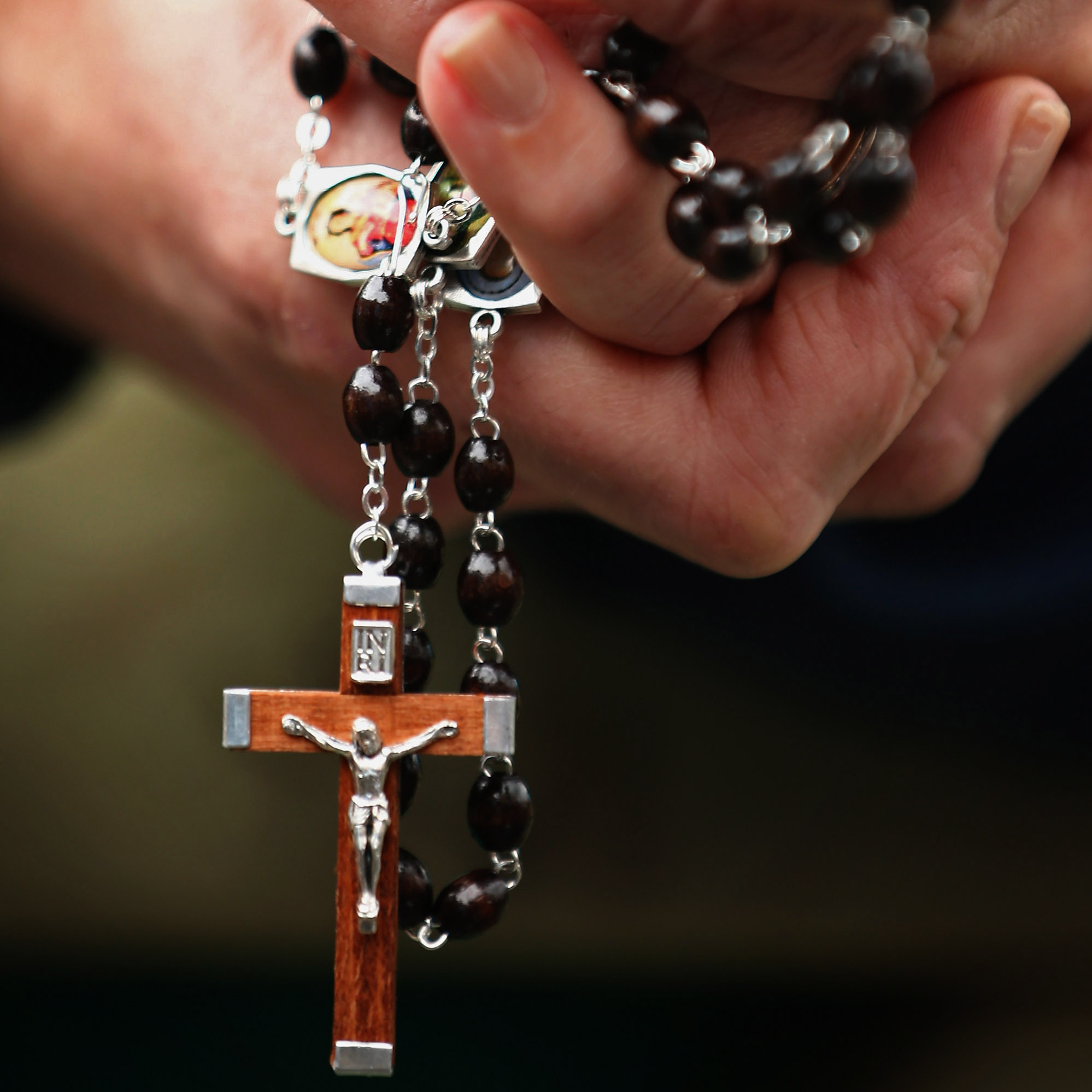 In Vatican City's St. Peter's Square on Wednesday, many of the faithful held rosary beads and prayed as they awaited word of a new pope.