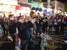 Twin Horns Of Joy? Members of the band The Bottom Dollars play on the street in Austin, Texas, during the opening night of the South by Southwest music festival. Twin Horns Of Joy? Members of the band The Bottom Dollars play on the street in Austin, Texas, during the opening night of the South by Southwest music festival.
