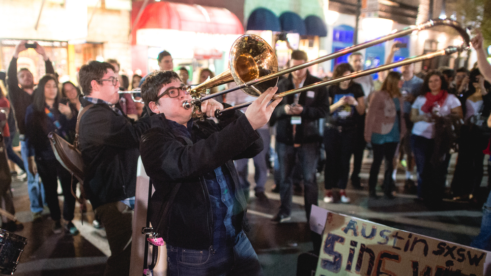 Twin Horns Of Joy? Members of the band The Bottom Dollars play on the street in Austin, Texas, during the opening night of the South by Southwest music festival.