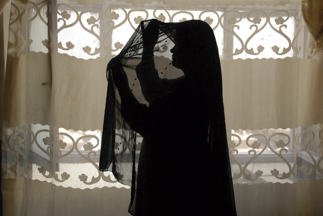 An unidentified Afghan prostitute fixes her headscarf to cover her face in Kabul, 2008. Afghanistan is one of the world's most conservative countries, yet its sex trade appears to be thriving. An unidentified Afghan prostitute fixes her headscarf to cover her face in Kabul, 2008. Afghanistan is one of the world's most conservative countries, yet its sex trade appears to be thriving.