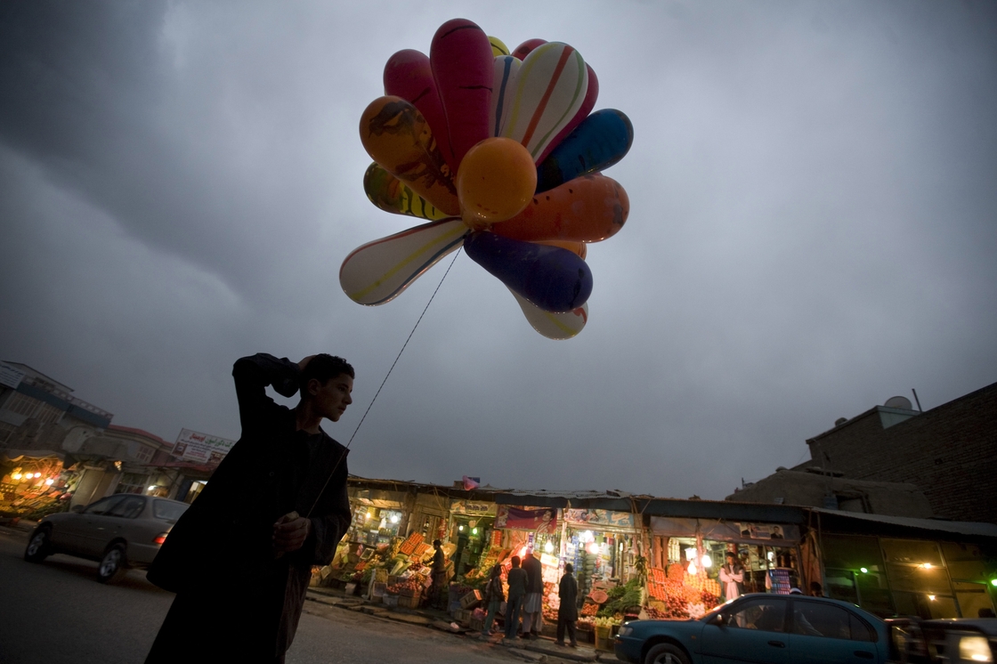 An Afghan boy selling balloons waits for customers in Kabul, 2009. An Afghan boy selling balloons waits for customers in Kabul, 2009.