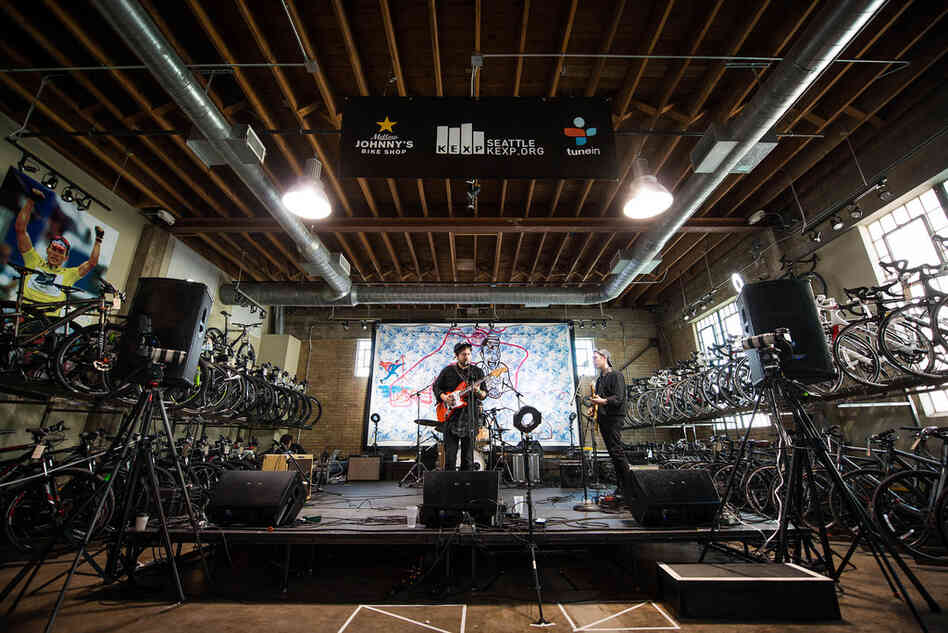 Framed by racks of bicycles, Unknown Mortal Orchestra plays the KEXP showcase at Mellow Johnny's. 