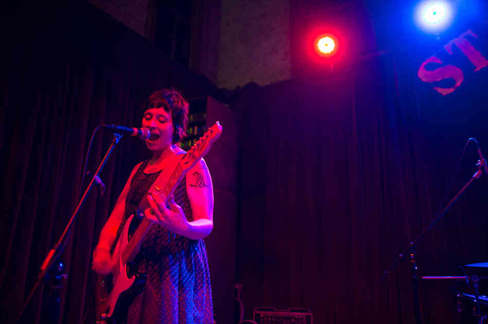 Waxahatchee's Katie Crutchfield began her set at the indoor stage at Stubb's by strumming three songs alone on an electric guitar, before being joined by two band mates.
