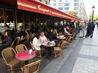 Diners eat at Fouquet's restaurant, a landmark on the Champs Elysees in Paris for more than a century. Traditional cafes and shops are steadily giving way to large global chains. Diners eat at Fouquet's restaurant, a landmark on the Champs Elysees in Paris for more than a century. Traditional cafes and shops are steadily giving way to large global chains.
