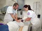 Students at the College of Central Florida in Ocala, Fla., perform CPR on a mock patient. Students at the College of Central Florida in Ocala, Fla., perform CPR on a mock patient.