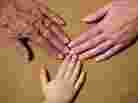 Hands from three generations.