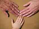 Hands from three generations. Hands from three generations.