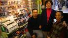 Wan Joon Kim (right), with his son Kirk and wife, Boo Ja, at their stall inside the Compton Swap Meet last January. Wan Joon Kim (right), with his son Kirk and wife, Boo Ja, at their stall inside the Compton Swap Meet last January.