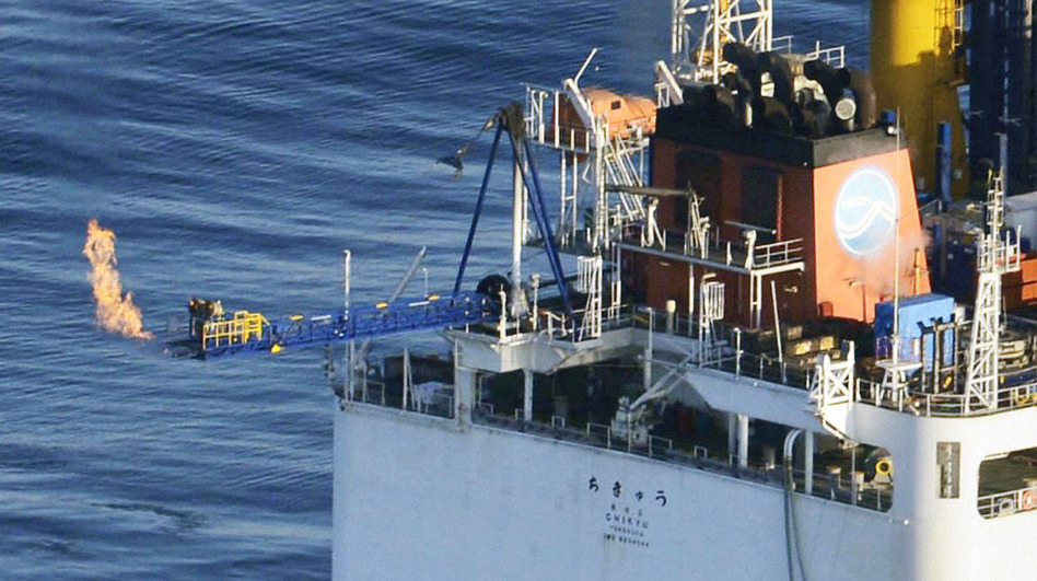 This photo from a Kyodo News helicopter shows a flame of natural gas from a Japanese deep-sea drilling ship on Tuesday. This successful extraction of methane from the seafloor was a world first.