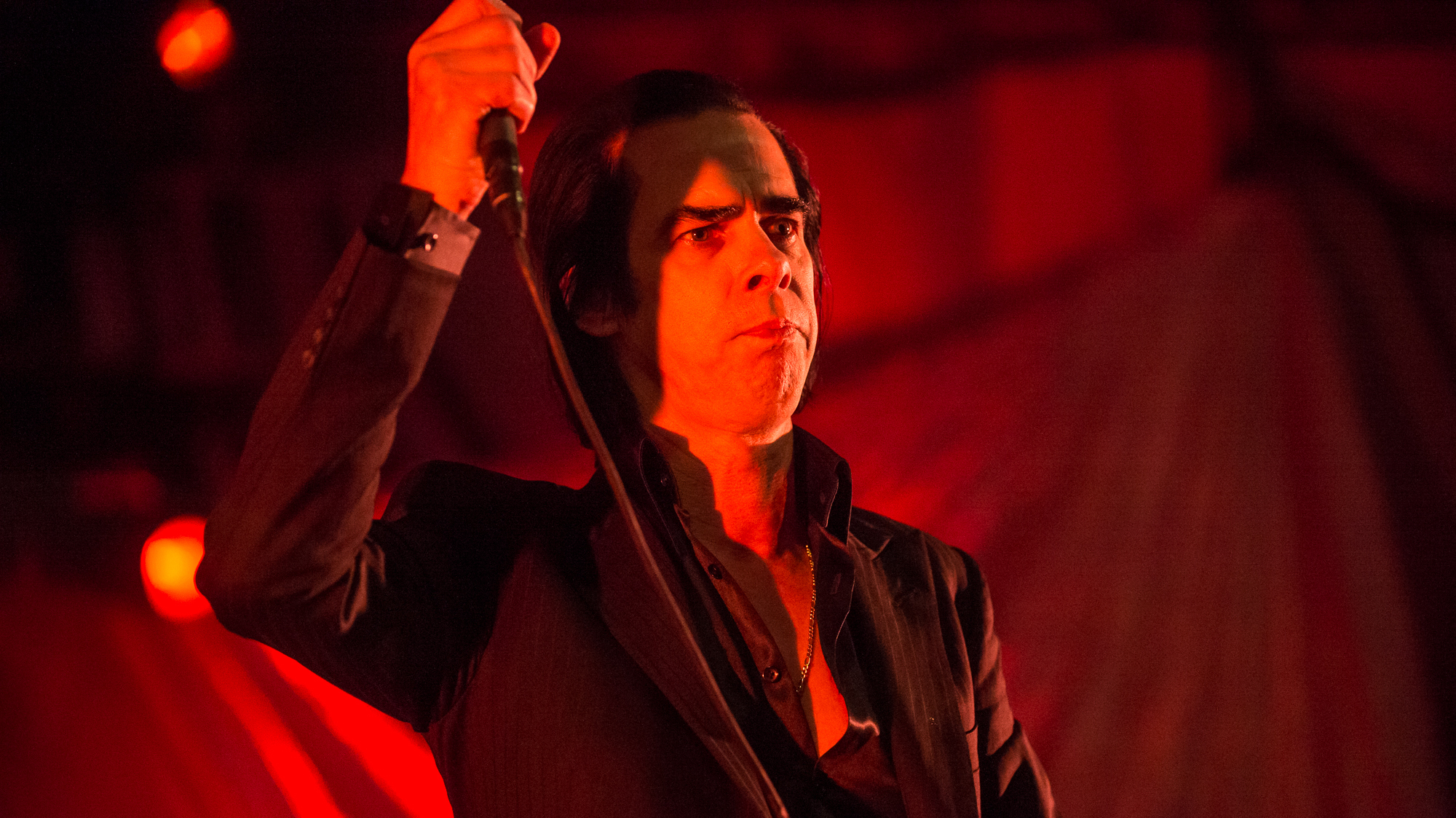 Nick Cave started his set with the Bad Seeds at Stubb's as the sun was going down. He told the crowd before it started that the first song would be a long one, so it would be dark by the time it ended.