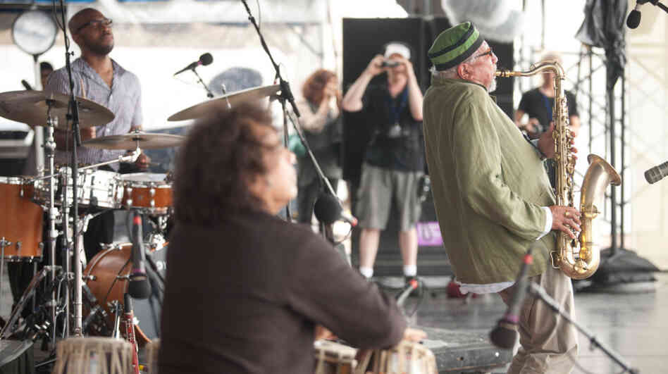 Sangam performs at the 2011 Newport Jazz Festival. From left to right: Eric Harland, Zakir Hussain and Charles Lloyd. Sangam performs at the 2011 Newport Jazz Festival. From left to right: Eric Harland, Zakir Hussain and Charles Lloyd.
