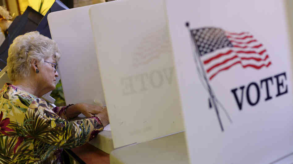 A voter fills out her ballot during early voting before the 2012 presidential election at the Gila County Recorder's Office in Globe, Ariz., on Oct. 26.