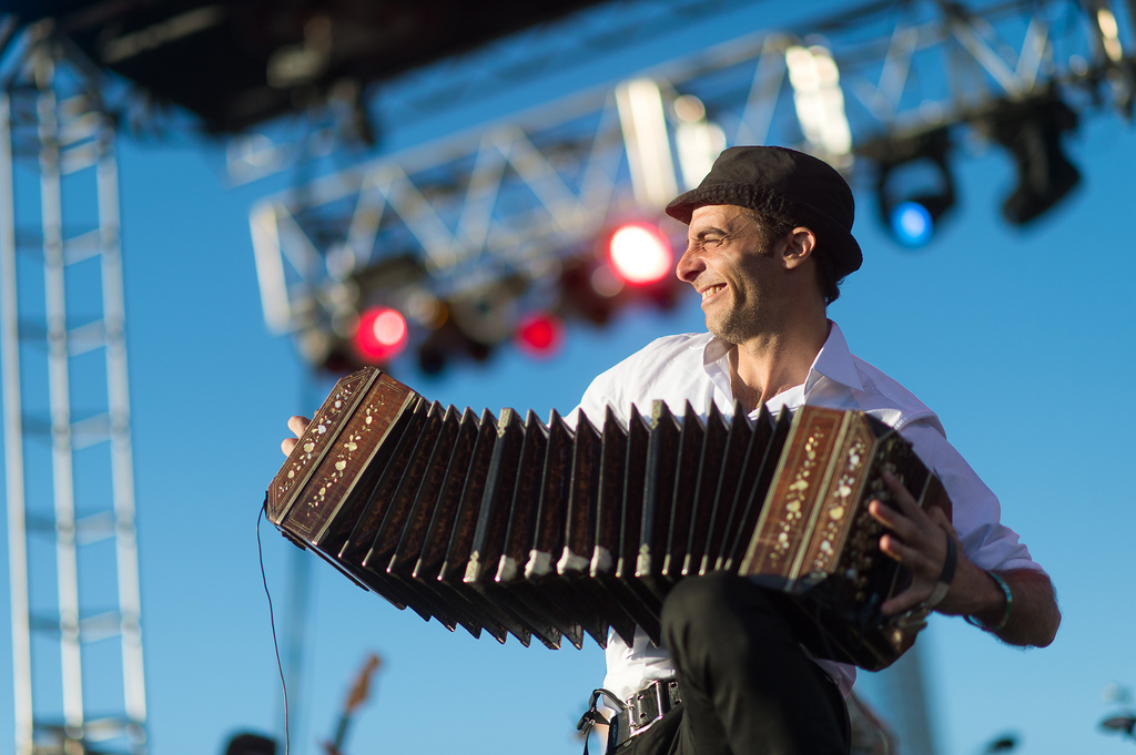 Bajofondo's Martín Ferrés stretches out his bandoneón as far as he can at <em>Alt.Latino</em>'s SXSW showcase.