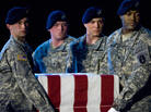 Members of the US Army's Old Guard carry team lift the remains of U.S. Army Specialist Israel Candelaria Mejias from San Lorenzo, Puerto Rico, as his body is returned on a C-17 to the U.S. from Iraq on April 7, 2009. Members of the US Army's Old Guard carry team lift the remains of U.S. Army Specialist Israel Candelaria Mejias from San Lorenzo, Puerto Rico, as his body is returned on a C-17 to the U.S. from Iraq on April 7, 2009.